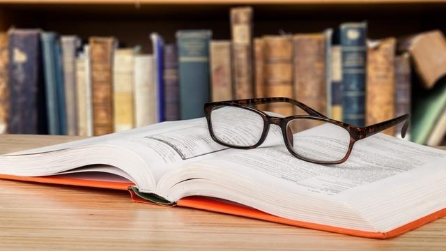 Glasses on law textbook