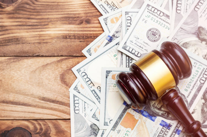 Gavel on top of paper currency
