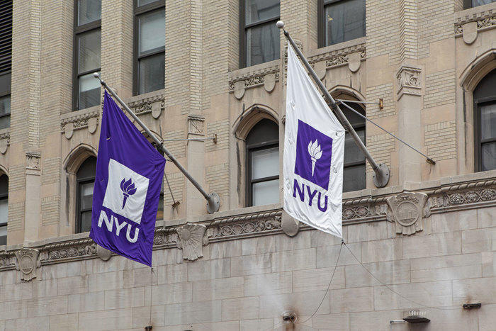 NYU Flags on side of campus building