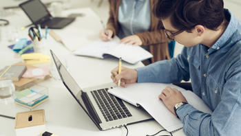 Students studying together in class